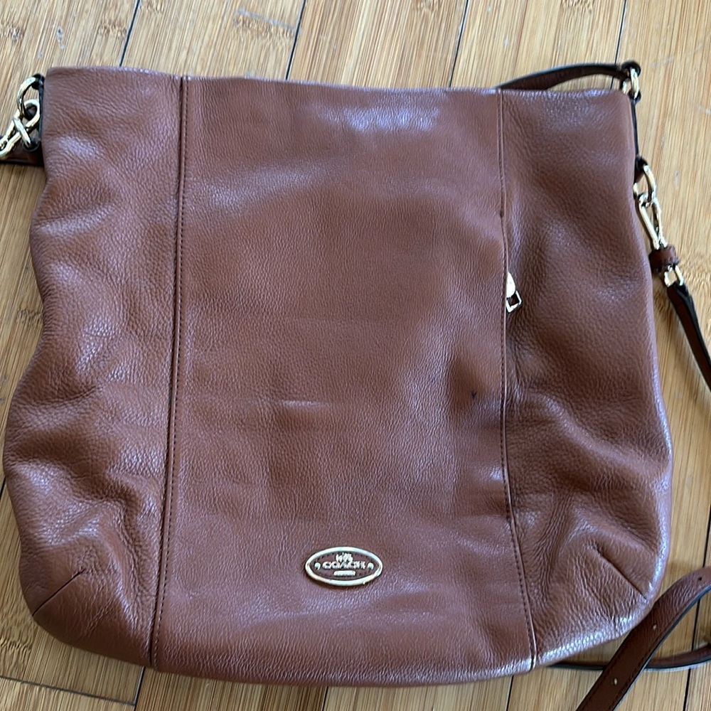 Coach brown leather sling bag zippered